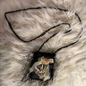 Cute black mini bag with pink floral detailing